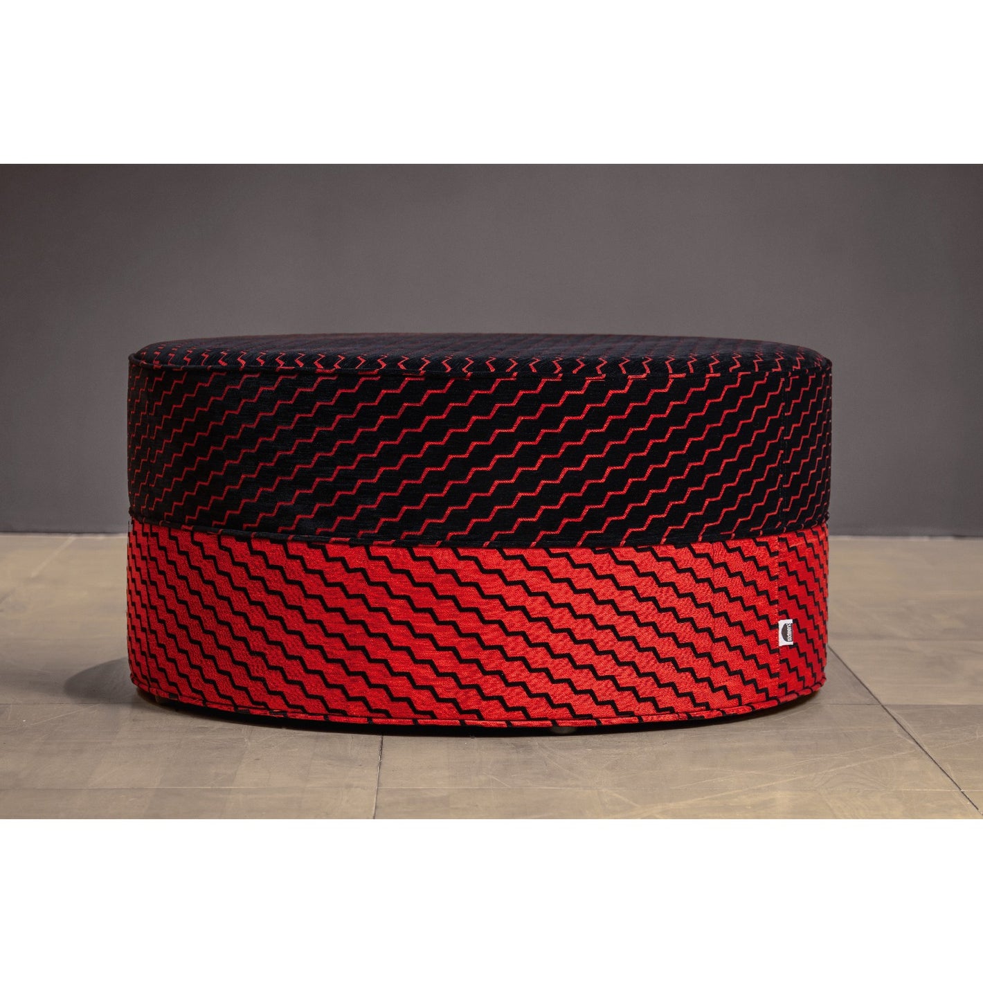 Buzz red black fabric on upholstered footstool