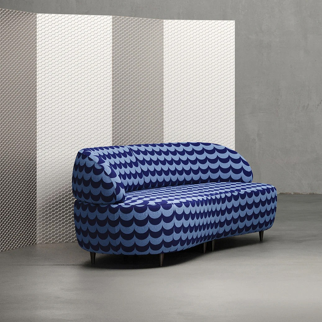 Scoop blue fabric on sofa with Buzz wallpaper